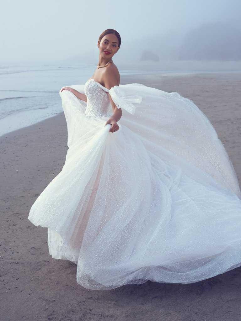 A woman in a white dress on the beach